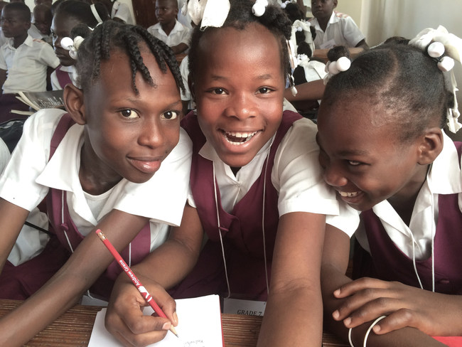 Smiling children of the Andrew Grene High School in Haiti