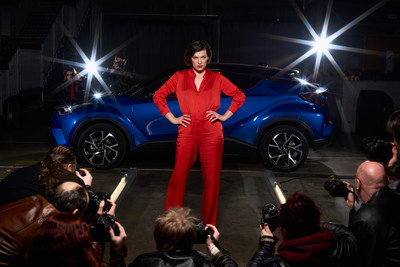 LONDON - 2 FEBRUARY: Milla Jovovich, actress and model, is captured stepping out of the new Toyota C-HR onto a catwalk at the world's first drive through immersive theatre experience. 'The Night that Flows' saw 100 guests experience the immersive event, which brought to life the different features of the new Toyota C-HR. (PRNewsFoto/Toyota)