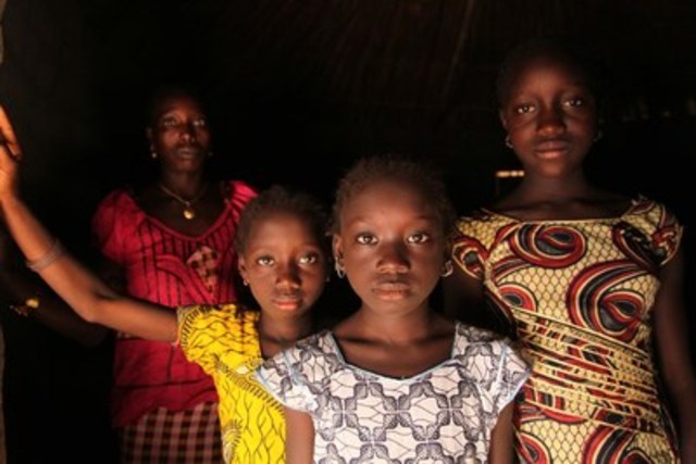 A woman and her daughters stand in their home, in the village of Cambadju in Guinea-Bissau. Their village was the first in the country to renounce female genital mutilation/cutting. © UNICEF/UNI137341/LeMoyne (CNW Group/UNICEF Canada)