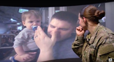 Corporal Trista Strauch is surprised by her family as she is virtually transported to the Super Bowl while stationed in Zagan, Poland. Credit: Hyundai Motor America
