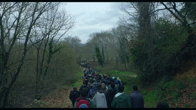 Walking refugees near Idomeni Camp in Greece. (PRNewsFoto/Participant Media)