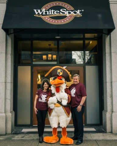White Spot’s Vice President of Marketing and Menu Development Cathy Tostenson, ‘Captain Beak Rogers’ and President Warren Erhart celebrate the launch of The Cluckaneers – the first 3D augmented reality kids program by a Canadian restaurant chain – at the Dunsmuir Street location in Vancouver. (CNW Group/White Spot)