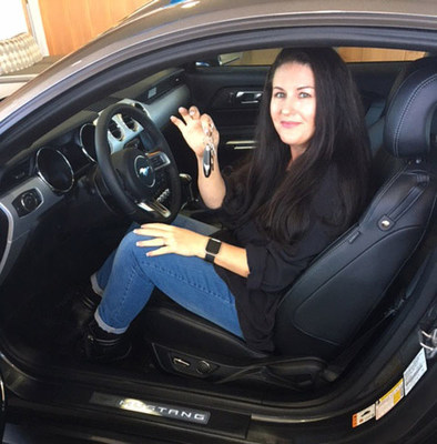 Robin Staudte, last year's winner of the Mustang 5.0 Fever Sweepstakes, picks up her 2017 Ford Mustang GT at Penske Ford in La Mesa, CA.