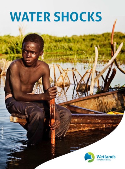 A boy in a boat in what is left of Lake Chad. (c)Klavs Bo (PRNewsfoto/Wetlands International)