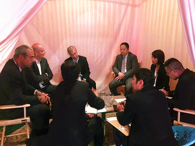 Vincent Rousset-Rouviere, president, and Gerard de Fleurieu, vice president of passenger car and light truck original equipment at Michelin, with Yu Jun and other staff from GAC Motor having a discussion at the Movin'On summit