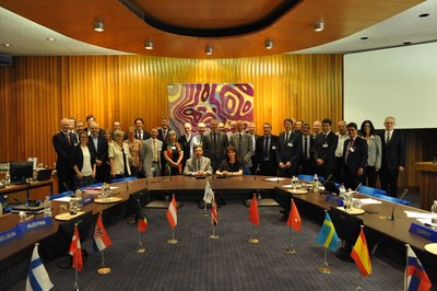 The Head of the Italian National Meteorological Service, Col. Silvio Cau, and ECMWF Director-General Florence Rabier (seated) signed the high-level agreement on the data centre in the presence of representatives from all 22 ECMWF Member States (PRNewsfoto/ECMWF)