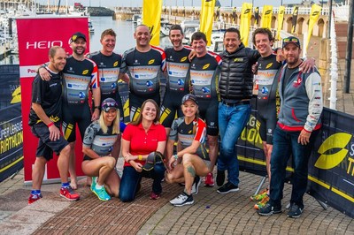 MaccaNow Foundation supporting team at the Super League Jersey Island, with Chris McCormack (third from right) (PRNewsfoto/HeiQ Materials AG)