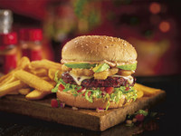 In the spirit of the New Year, Red Robin Gourmet Burgers and Brews is encouraging guests to keep their resolutions on track with its new Gourmet Veggie Burger, a custom-blended, ancient-grain-and-quinoa veggie patty piled high with Swiss cheese, Parmesan-sprinkled mushrooms, tomato bruschetta salsa, fresh avocado slices, sun-dried tomato spread and shredded romaine on a whole grain bun. It’s a veggie burger finally done right and available at Red Robin restaurants nationwide. (PRNewsfoto/Red Robin Gourmet Burgers...)