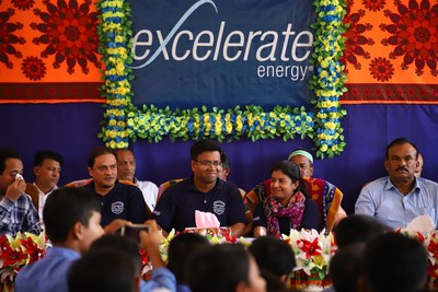 Excelerate Energy officials distribute school supplies to the students of Ghotibhanga Government Primary school in Bangladesh.