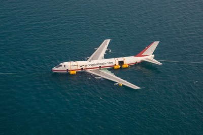 An aerial shot of the aircraft during the process of being submerged