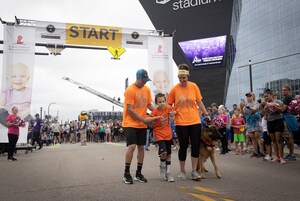 St. Jude patient takes first steps since treatment alongside role model at St. Jude Walk/Run