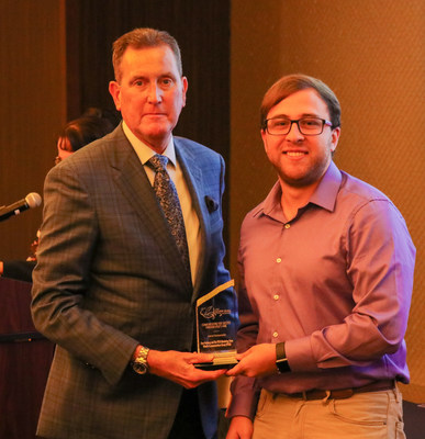 VTLO Communications Specialist Dan Feinberg (right) receives the Silver Quill Award of Excellence from IABC Heritage Region Chair Matt Evans at the IABC Heritage Region Conference in Detroit on Monday, Sept. 23, 2019.