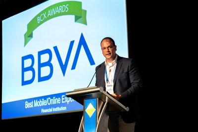 BBVA USA eBanking Channels Mobile Product Manager Gilbert Strickland accepts the Best Mobile/Online Experience award in Chicago.