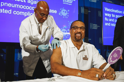 Mark May, a two-time Super Bowl champion with the Washington Redskins, rolls up his sleeve for his annual flu vaccine at the National Foundation for Infectious Diseases (NFID) 2019 Influenza/Pneumococcal News Conference. The Centers for Disease Control and Prevention (CDC) recommends that everyone age 6 months and older get vaccinated against influenza each year.