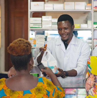 A pharmacist dispenses medical products to a customer in Lagos, Nigeria. Photo Credit: Chukwudera Obumselu