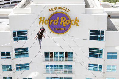 Seventh generation member of the Flying Wallendas, Nik Wallenda - with his 66-year-old mother, Delilah - thrilled guests with a 150-foot-long high wire walk between the two towers of Seminole Hard Rock Hotel & Casino Tampa, following the Grand Celebration guitar smash (counted down by actress Nicole Kidman) on the newly expanded pool deck, 175 feet below.