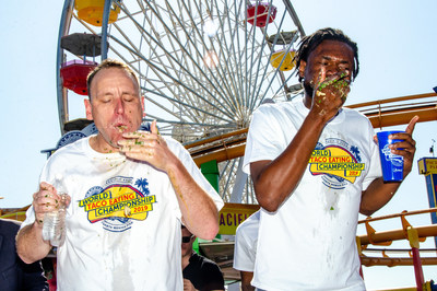 The #1-Ranked Competitive Eater In The World, Joey Chestnut (L) of San Jose, Calif. and Gideon Oji (R) of Morrow, GA compete at the second annual Pacific Park World Taco-Eating Championship on “National Taco Day,” Friday, October 4, 2019, at Pacific Park on the Santa Monica Pier in Santa Monica, Calif. Chestnut demolished 82 Pacific Park street-style carnitas tacos to defend his title and retain the Major League Eating world record. (Photos by Fabian Lewkowicz for Pacific Park)