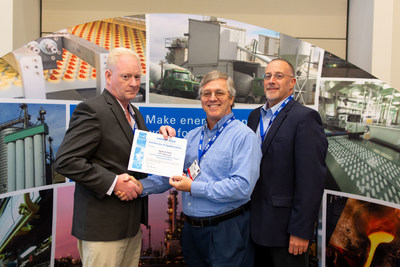 Plant Manager David Laden (left) is presented the certification by Dr. Gale Boyd (middle) from Duke University, who is part of the ENERGY STAR team and developed the benchmarking tool used to assess the energy efficiency of fluid dairy plants, and Bob Hale, Agawam maintenance manager (right).