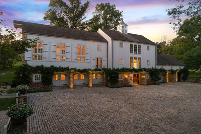 A tri-level barn combines handsome living spaces with equestrian amenities. It includes living space for family or friends and is complete with bedrooms, baths and a full kitchen. On the lower level, there are four stalls, a wash room, and a tack room, while 3 paddocks with auto-watering pedestals and run-in stalls are just beyond the barn doors. NewJerseyLuxuryAuction.com.