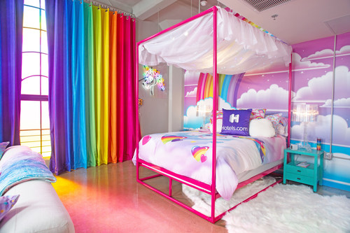 The Hotels.com Lisa Frank Flat is complete with a technicolor rainbow window display, a light-up canopy bed and Instagram-worthy wall mural