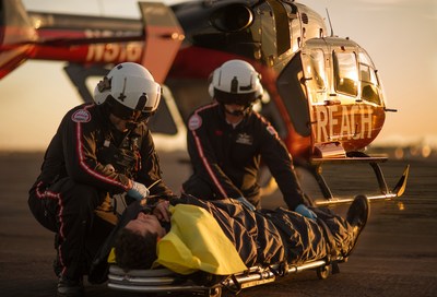 Air medics deliver critical care to a patient requiring air ambulance assistance.