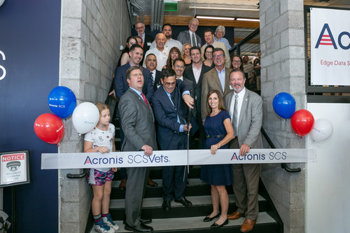 (Front, LtoR) Congressman Greg Stanton, Acronis SCS CEO John Zanni, Arizona Senator Martha McSally, and Scottsdale Mayor Jim Lane, lead the ribbon cutting ceremony to officially open Acronis SCS headquarters in Scottsdale, Ariz. The event included the announcement of SCSVets, an initiative to provide at least 300 veterans, active duty military, and military spouses with the credentials, skills, and resources necessary to pursue a cybersecurity career.