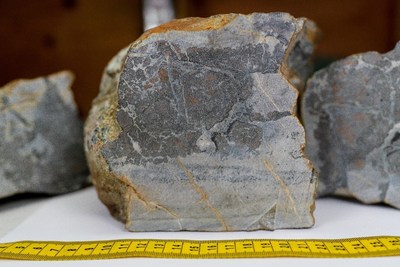 Representative sample B0003611 assaying 7.7% Ni, 0.85% Co, 0.17% Cu, and 10.9 g/t Ag with additional rep. samples for the showing in the background. (CNW Group/Crystal Lake Mining Corporation)