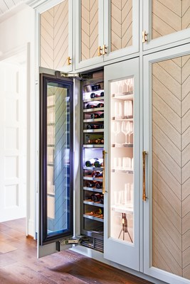 A focal point in the one-of-a-kind kitchen is the Signature Kitchen Suite integrated column wine refrigerator that is redefining wine storage and preservation for at-home collections. Both the 18- and 24- inch models are featured within the home to showcase their built-in versatility. The refrigerator incorporates exclusive Wine Cave™ technology which significantly reduces vibration, minimizes temperature fluctuations, limits light exposure and locks in humidity. Photography Credit: David Land