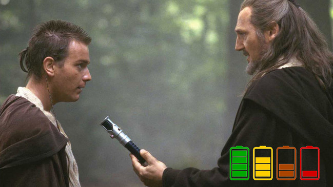 Qui-Gon hands Obi-Wan his lightsaber with dead battery