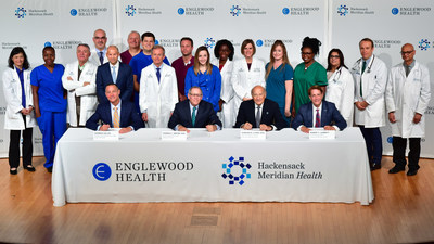 Warren Geller, president and CEO, Englewood Health; Thomas C. Senter, Esq., chairman, Board of Trustees, Englewood Health; Gordon N. Litwin, Esq., chairman, Board of Trustees, Hackensack MeridianHealth; and Robert C. Garrett, FACHE, CEO, Hackensack Meridian Health. The two health care systems have signed a definitive agreement to merge. Also pictured are physicians, nurses, and other clinical staff from Englewood Health and Hackensack MeridianHealth. Warren Geller, president and CEO, Englewood Health; Thomas C. Senter, Esq., chairman, Board of Trustees, Englewood Health; Gordon N. Litwin, Esq., chairman, Board of Trustees, Hackensack MeridianHealth; and Robert C. Garrett, FACHE, CEO, Hackensack Meridian Health. The two health care systems have signed a definitive agreement to merge. Also pictured are physicians, nurses, and other clinical staff from Englewood Health and Hackensack MeridianHealth.