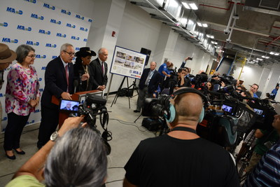 From left: MIA Director and CEO Lester Sola (center), joined by Miami-Dade County Commissioner Daniella Levine Cava, U.S. Representative Frederica Wilson, and County Commissioner Javier D. Souto, discusses the new baggage screening system.