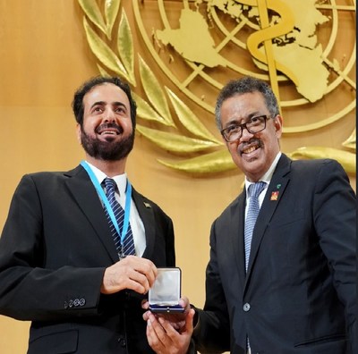 H. E. Dr. Tawfig AlRabiah, Minister of Health, receiving the 'WHO Tobacco Control Medal' from Dr. Tedros Ghebreyesus, Director-General, WHO.