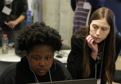 With guidance from an Amazon Games engineer, Kayla, a sophomore at Howard University, works on design details during the D.C. hackathon. Kayla's team later took the top prize for its game, 