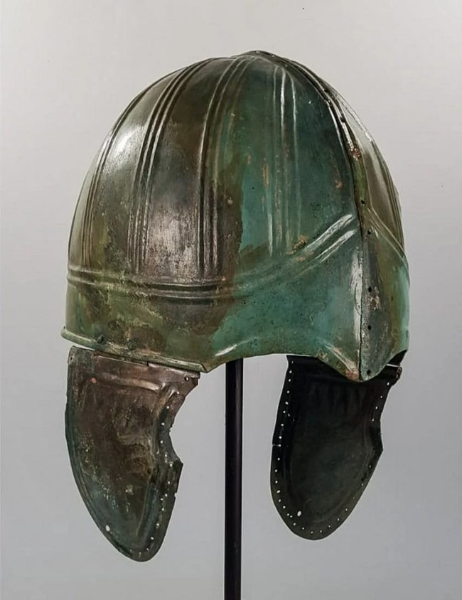 Greek Hoplite                          Chalcidian-type helmet with cheek guards,                          geometric embossing, circa 400 B.C., comes with                          scientific report written by Dr. Ivan Bonchev,                          PhD, University of Oxford. Estimate:                          £20,000-£50,000