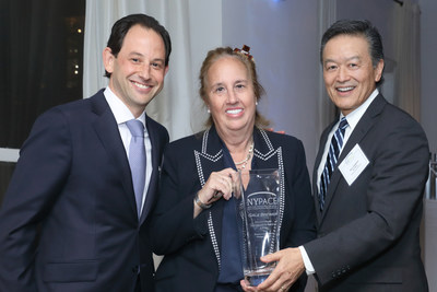 Manhattan Borough President Gale Brewer receiving the NYPACE Visionary Leadership Award from Board Chair Dan Zamlong, left, and Executive Director Ken Inadomi.