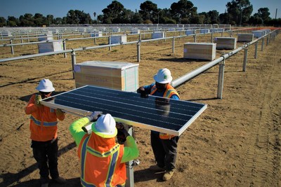 Workers installing the first of many Oregon-assembled SunPower Performance Series Solar Panels at a Gap Inc. distribution center in Fresno, Calif.