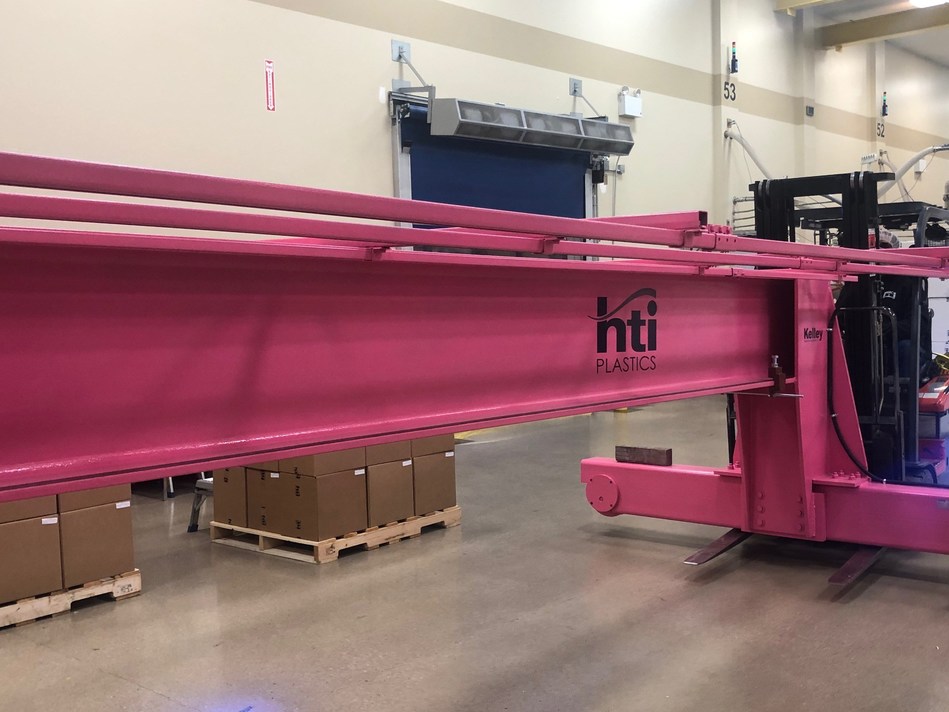 HTI Plastics Installs Pink Crane in Support of Breast Cancer Awareness