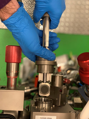 Evan Groopman, a research physicist, inserts Nuclear Signatures Inter-laboratory Measurement Evaluation Program (NUSIMEP-9) uranium particles on a carbon planchette into the NAUTILUS to analyze the uranium isotopic composition in the Accelerator Mass Spectrometry Laboratory at the U.S. Naval Research Laboratory in Washington, D.C., Sept. 5. (U.S. Navy photo by Nicholas E. M. Pasquini) Evan Groopman, a research physicist, inserts Nuclear Signatures Inter-laboratory Measurement Evaluation Program (NUSIMEP-9) uranium particles on a carbon planchette into the NAUTILUS to analyze the uranium isotopic composition in the Accelerator Mass Spectrometry Laboratory at the U.S. Naval Research Laboratory in Washington, D.C., Sept. 5. (U.S. Navy photo by Nicholas E. M. Pasquini)