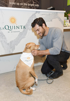 Veterinarian Dr. Evan Antin and therapy dog Boon ‘Take A Paws’ at a La Quinta by Wyndham hotel.