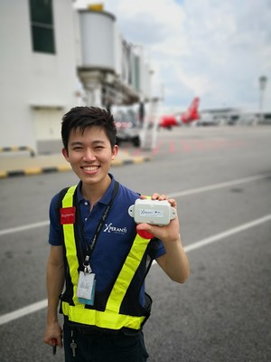 Xperanti Engineer holding a Digital Matter Oyster Sigfox Battery Powered Tracking Device