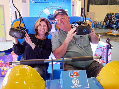 LiggettVille owners Michelle and Jim Liggett preparing to put on their masks and experience the virtual reality game "Virtual Rabbits" located in their new arcade.