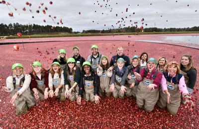 Ocean Spray Farmer-Owner Sue Gilmore, front row, third from right, and her daughters, Alison, fourth from right, and Abbie second from right, welcome HelloFresh to their family farm to announce Ocean Spray as the exclusive cranberry provider for the home meal preparation company in Carver, Mass. (Josh Reynolds/AP Images for Ocean Spray)