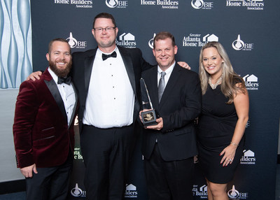 The EMC Homes Team with their first Gold OBIE Award. From left to right, Dusty Talbert (Director of Marketing), Donovan Haag (CFO), James McIntyre (Partner), and Jaclyn Riddle (Sales Manager)