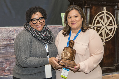 Sloane Drake, senior vice president of Human Resources at Georgia Power (left) presents Ann Marie Herrera (right) with the 2019 Preston Arkwright Award for service.