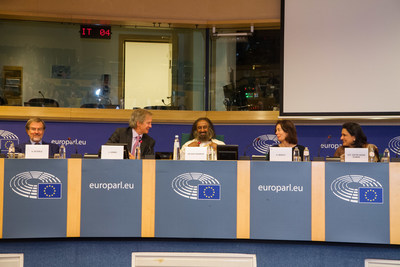 Members on the dias share a lighter moment at the event titled 'From Meditation to Mediation' at the European Parliament