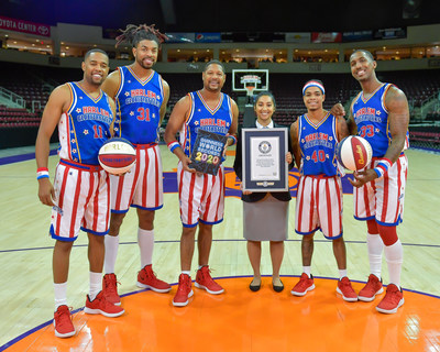 The Harlem Globetrotters today added six new GUINNESS WORLD RECORDS titles to their long record of accomplishments. The new records bring the team's total to 22 GUINNESS WORLD RECORDS titles. (L-R: Cheese Chisholm, Hammer Harrison, Handles Franklin, Guinness World Record Adjudicator Christine Fernandez, Wham Middleton, Bull Bullard) Still Photo Courtesy: Brett Meister, Harlem Globetrotters.