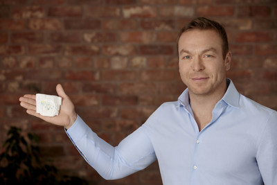 Sir Chris Hoy with a Pampers Preemie Protection nappy