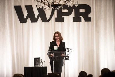 Maura Corbett, Chief Executive Officer and Founder, Glen Echo Group, accepts the 2019 WWPR Woman of the Year Award.