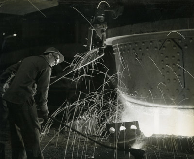 Fritz Henle. Taking a sample of steel for testing, Geneva Steel Plant, Geneva, Utah. Photo: Baker Library Special Collections.