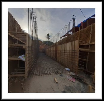 Construction of the tunnel and retaining wall for the crushing circuit (CNW Group/TVI Pacific Inc.)